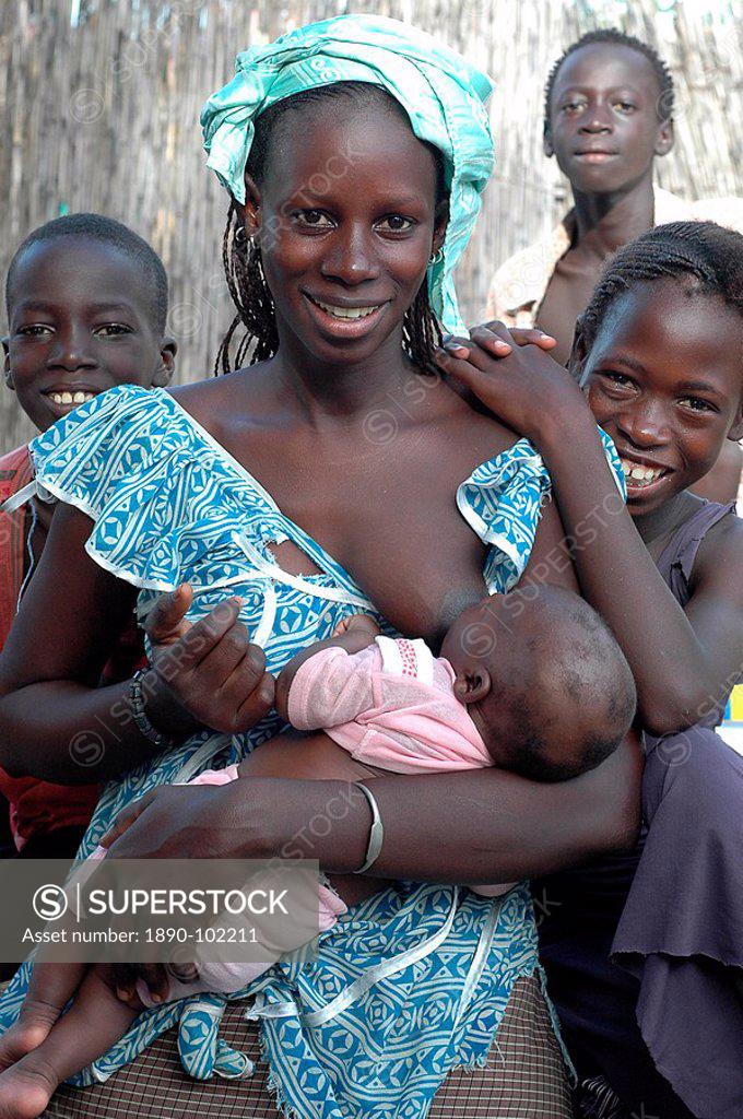 Stock Photo: 1890-102211 Young mother breast feeding, Ndiobene Talleine, Kaolack, Senegal, West Africa, Africa