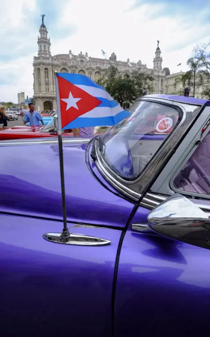 Cuban flag on antenna of vintage car, Havana, Cuba, West Indies, Central America