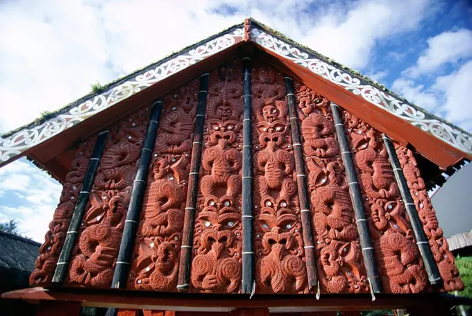 Intricately carved storehouse in replica village at the Maori Arts and Crafts Institute, Whakarewarewa thermal and cultural area, Rotorua, North Islan...