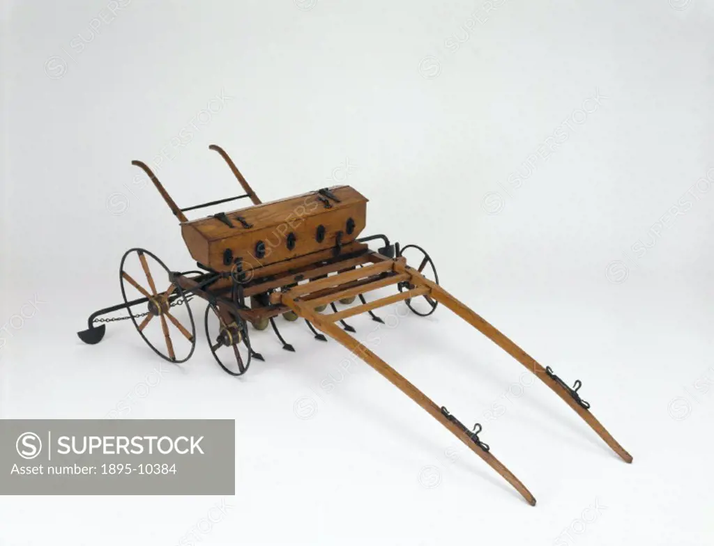 This model represents an improved version of the grain drill sowing machine  devised by S Morton in Edinburgh in 1828. Seeds were passed from a hopper   - SuperStock