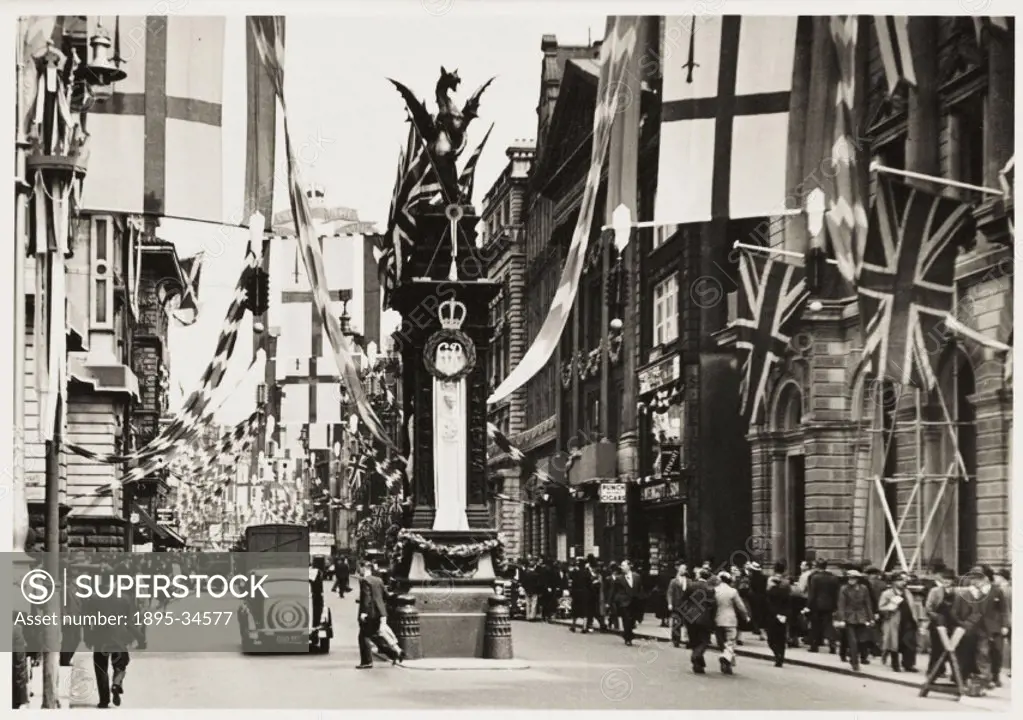 A photograph of Temple Bar in Fleet Street, London, taken by an unknown photographer in May 1937. The street is decorated with flags and bunting to ce...
