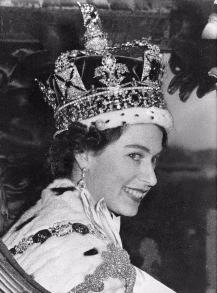 Young Queen. The Queen, who succeeded her father King George VI on February 6th 1952, smiling to her people from the carriage after her coronation cer...