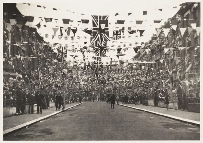 A photograph of the decorations in Catherine Road, Tottenham, London, taken by an unknown photographer in May 1937. The street had been decorated to c...