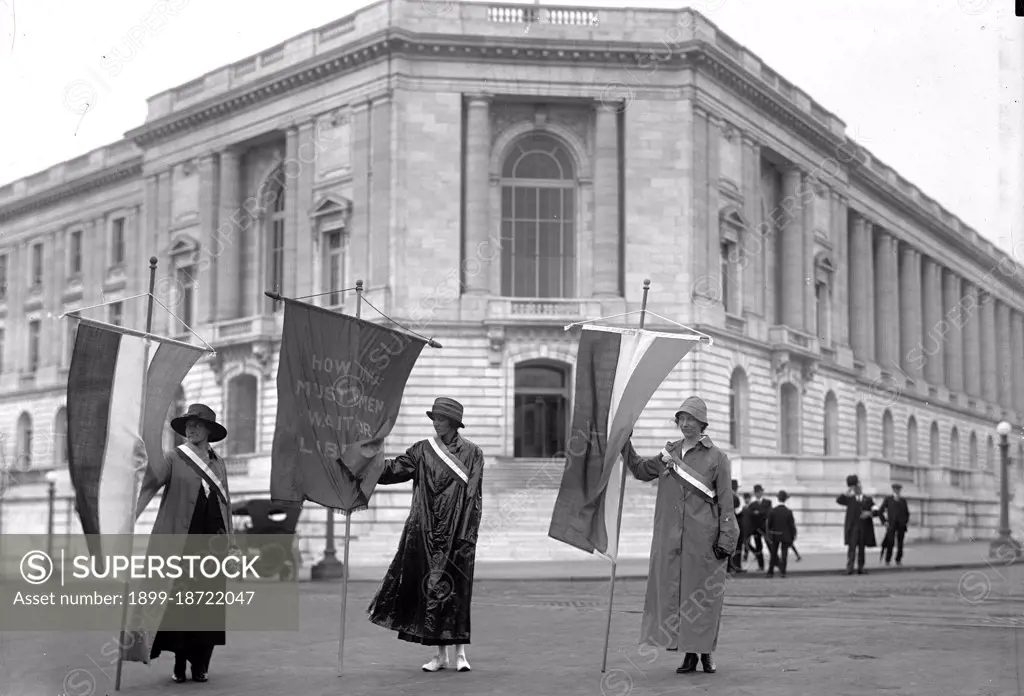 Woman suffragettes picketing at the senate office building, Mildred Gilbert, Pauline Floyd, and Vivian Pierce circa 1918.