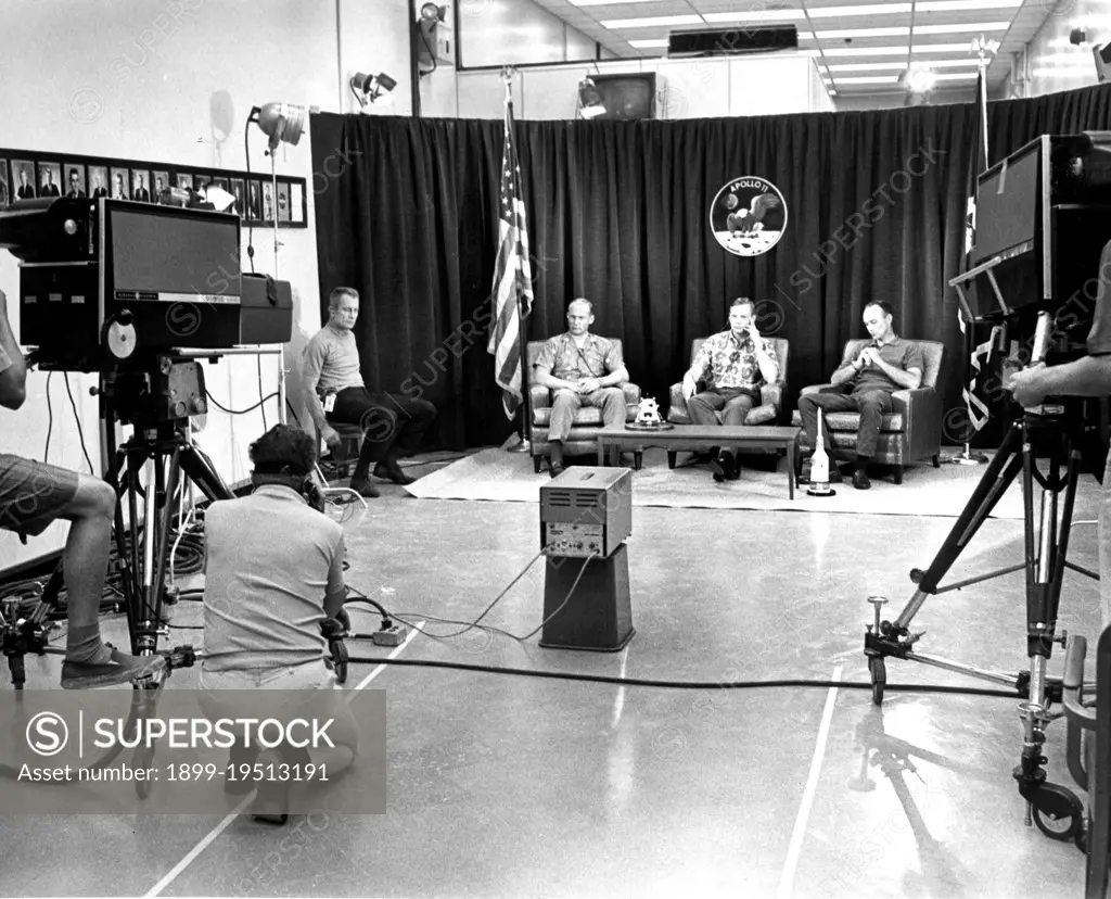 The night before launch day, Apollo 11 crew members (R-L) Michael Collins, Neil Armstrong, and Edwin Aldrin, participated in a closed circuit press conference the night before they began their historic lunar landing mission. At far left is chief astronaut and director of flight crew operations, Donald K. Slayton.