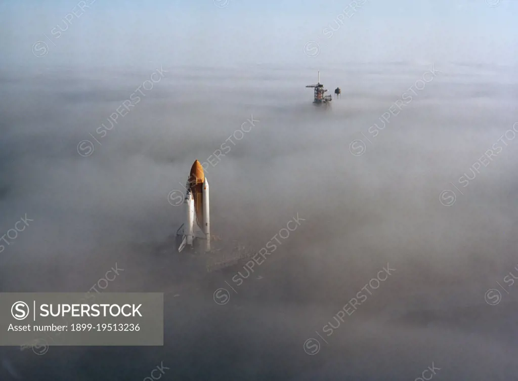 (30 Nov. 1982) --- The space shuttle Challenger, atop a mobile launch platform, slowly moves through the Florida fog to Launch Pad 39A in preparation for its first liftoff early next year.