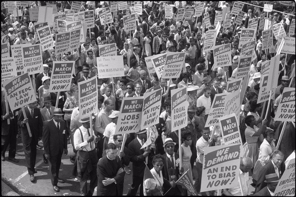 Demonstrators marching in the street holding signs during the March on Washington. August 28, 1963. (Marion S. Trikosko/US News & World Report Photograph Collection/GG Vintage Images/UIG)
