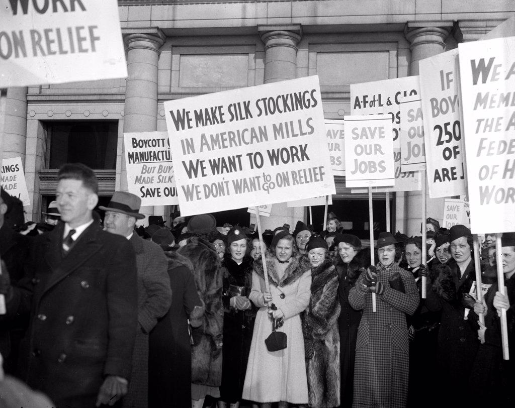 Marchers picketing against a silk boycott circa 1938.