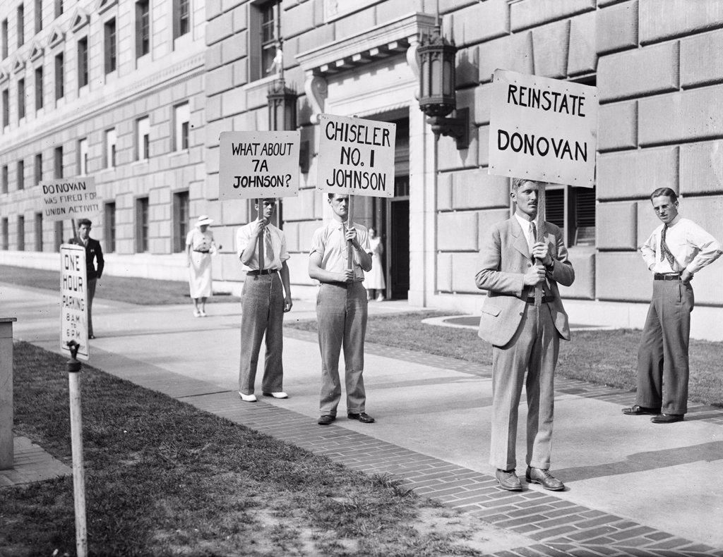 Protesters with signs: 'Johnson unfair to labor,' 'Reinstate Donovan,'  June 1934.