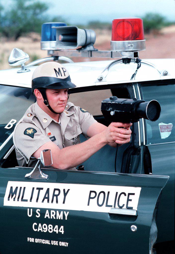 1976 - A US Army military policeman uses radar speed detection equipment. 