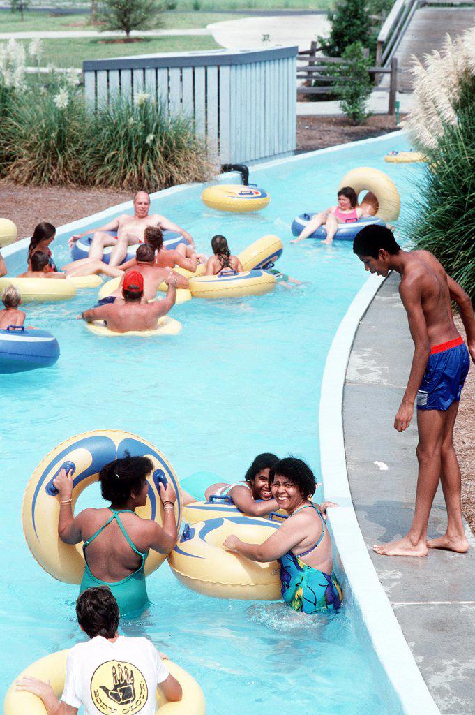 1988 - Kids and families having fun at a water park in the United States,  1980s . 