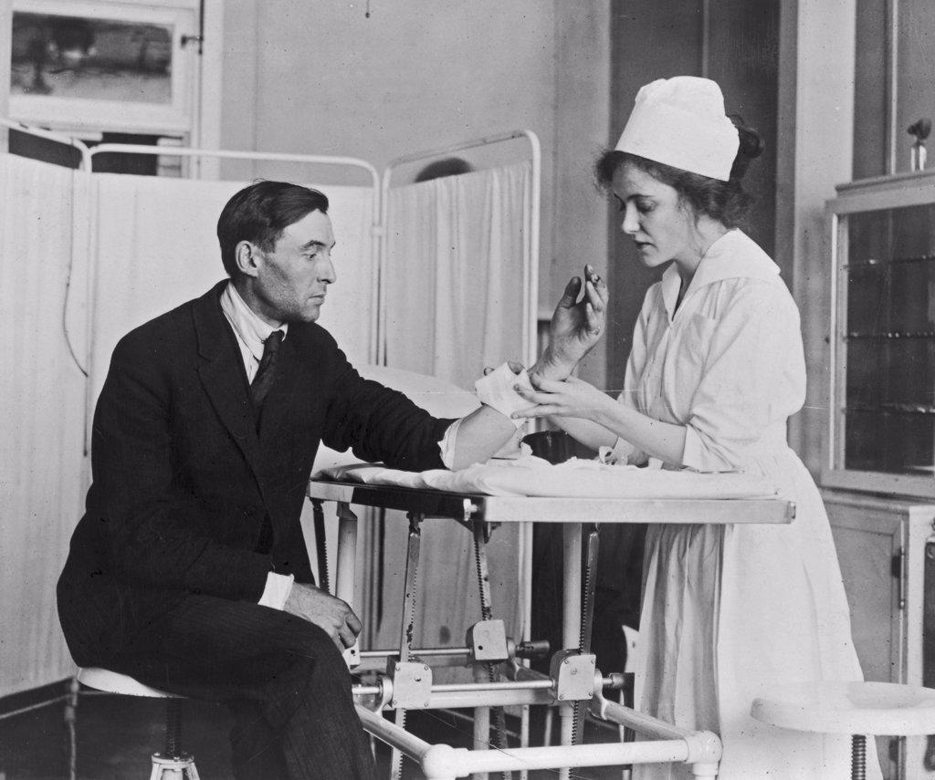 Public Health Service nurse treating patient ca.  1918.