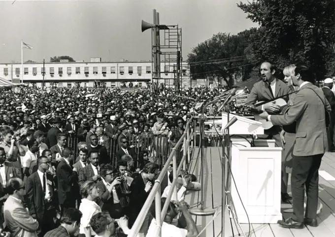 Folk singers Peter, Paul and Mary perform at the March on Washington, 8/28/63. Left to right: Paul Stookey, Mary Travers and Peter Yarrow. (GG Vintage Images/UIG)