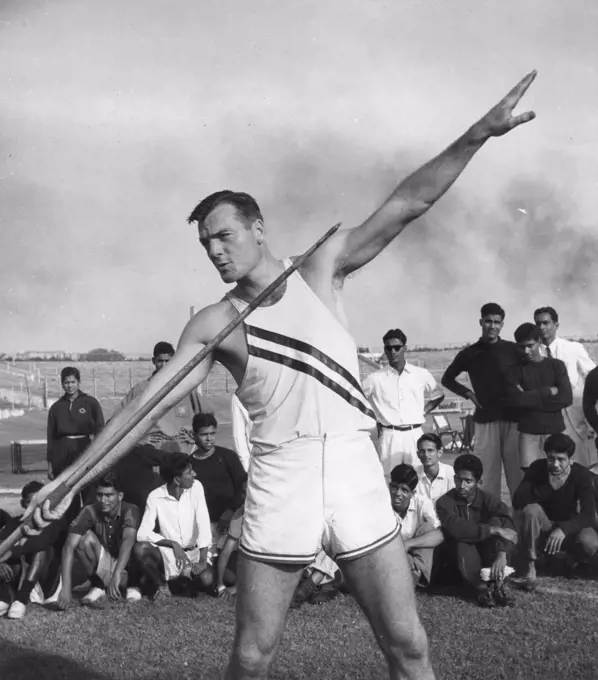 Bob Mathias (1930-2006), US Olympic decathlete, demonstrates the javelin throw for the benefit of young athletes at the Vallabhbhai Patel Stadium during his good will tour of more than 40 countries sponsored by the US State Department, Bombay, India, 1956. (Photo by United States Information Agency/GG Vintage Images)