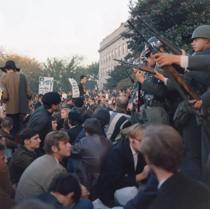 Members of the Military Police keep back Vietnam War protesters during their sit-in at the Mall Entrance to the Pentagon. This was the first major protest against the war, Washington, DC, 10/21/1967. GG Vintage Images