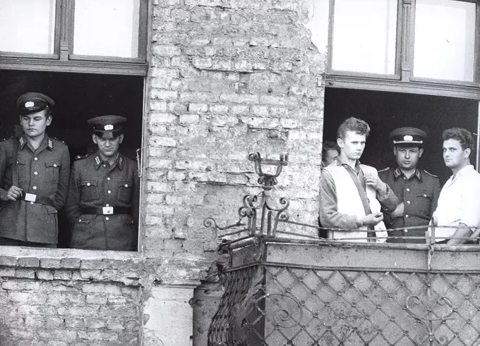Berlin Wall Photo - 10/3/1961 - The Windows Up to the 4th Level of the Evacuated Houses at Bernauer Strasse Are Cemented Shut Under Supervision of the Volkspolizei. 
