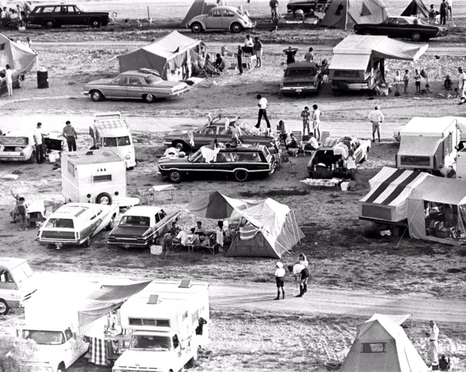 The early morning sun found hundreds of spectators on the beaches and roadways near the NASA Kennedy Space Center (KSC) where they had camped the night before to witness history by watching the epic beginning of the journey of Apollo 11. . 
