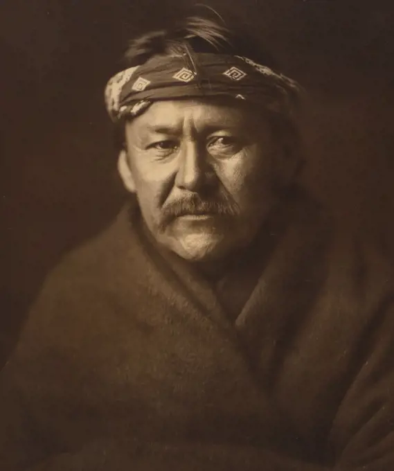 Edward S. Curtis Native American Indians - A Navajo man, head-and-shoulders portrait, wearing blanket and headband ca. 1904. 