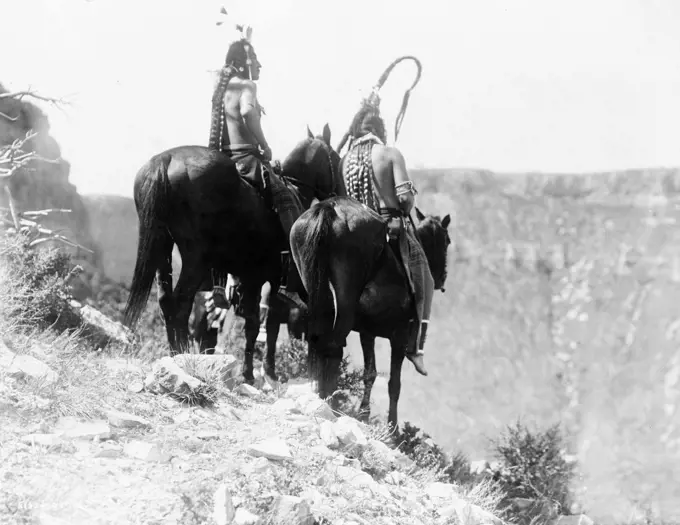 Edward S. Curtis Native American Indians -  Packs The Hat and Which Way, two Crow Indians on horseback, Montana ca. 1905. 