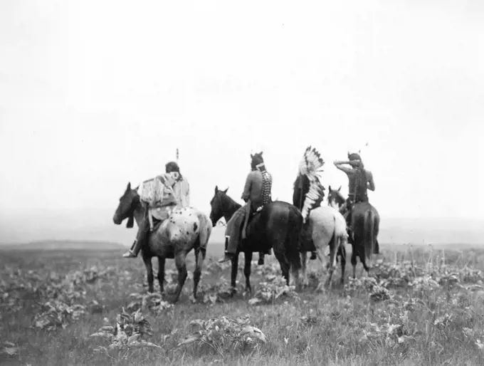 Edward S. Curtis Native American Indians - Four Crow Indians, including Shot in the Hand and Bull Chief, on horseback, Montana ca. 1905. 
