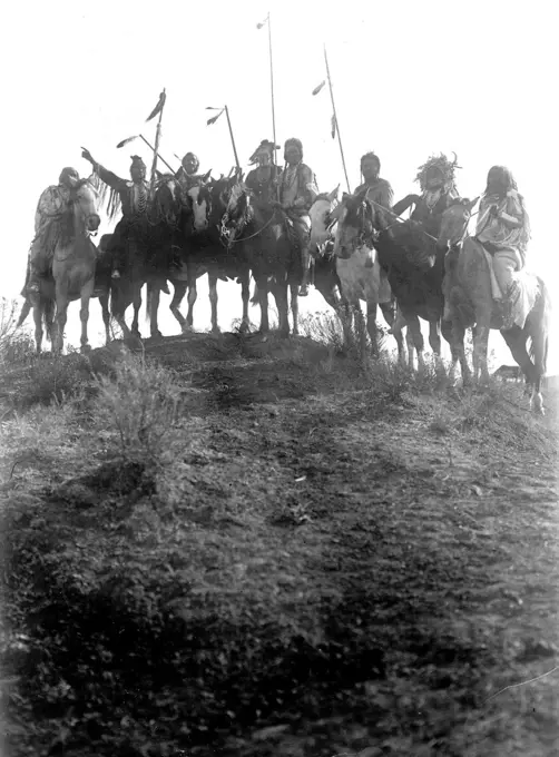 Edward S. Curtis Native American Indians - Eight Crow Indians on horseback, silhouetted on top of hill in Montana ca. 1908. 