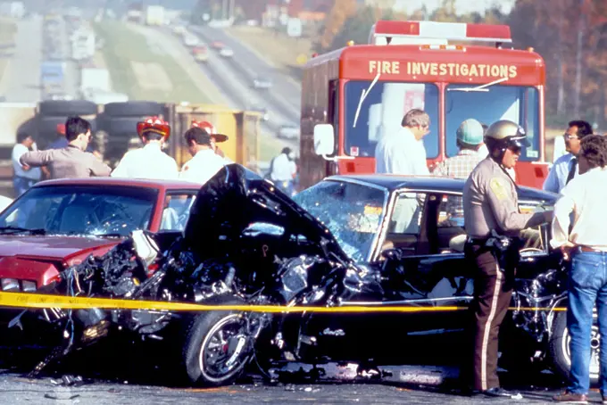 This photograph, captured in metropolitan Atlanta, Georgia, depicts what had been a severe motor vehicle collision. At this point, Atlanta police, paramedics, and the Fire Investigation Team, were all on the scene. The drivers’ conditions were not known, nor the details surrounding the cause of this accident. 