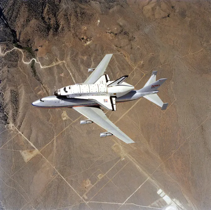 (4 July 1982) --- This spectacular view of the NASA 905 transport aircraft taxiing the new space shuttle Challenger was recorded from a T-38 aircraft