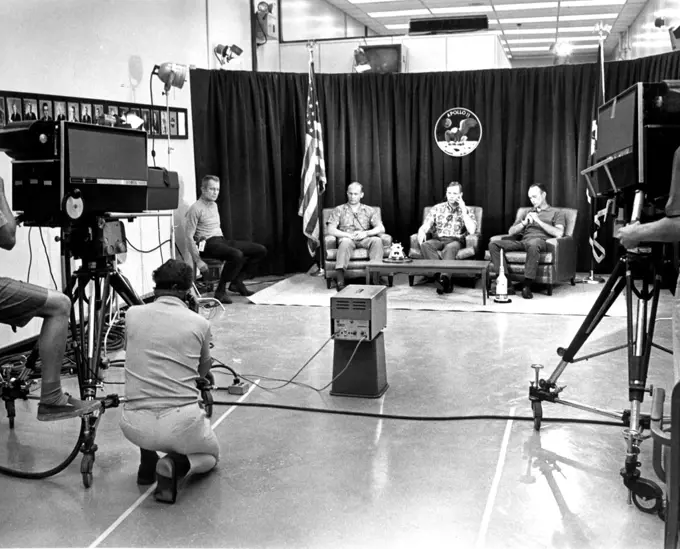 The night before launch day, Apollo 11 crew members (R-L) Michael Collins, Neil Armstrong, and Edwin Aldrin, participated in a closed circuit press conference the night before they began their historic lunar landing mission. At far left is chief astronaut and director of flight crew operations, Donald K. Slayton.