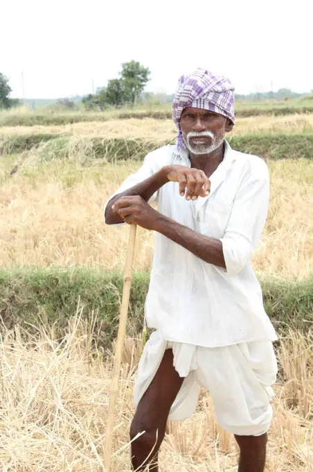 Portrait of a farmer during a hard days work in a rural village. Javadhu Hills, Tamil Nadu. India. (Photo by: Raj Kumar/Majority World/UIG)