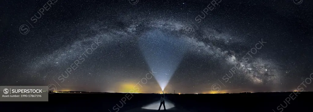 Self portrait on road with full milkyway including core in rural Manitoba Canada