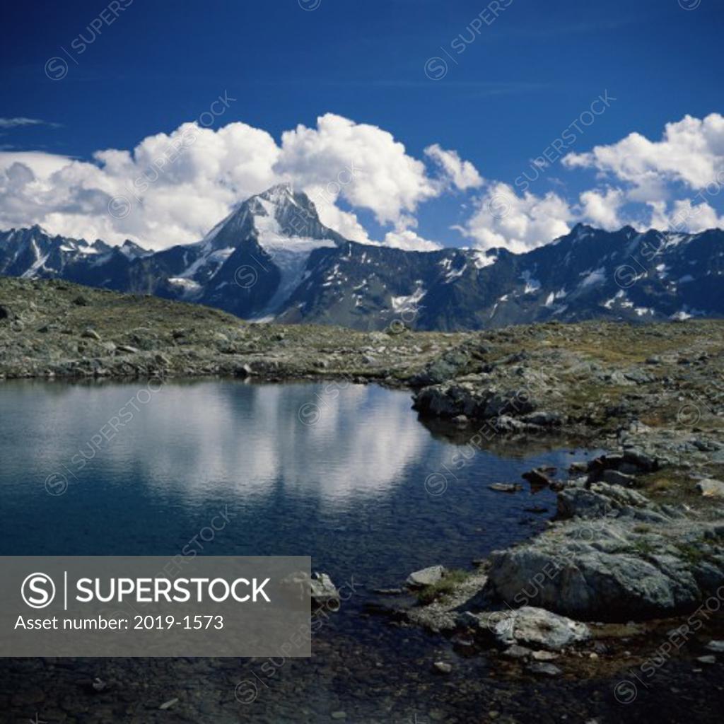 Stock Photo: 2019-1573 Clouds over a mountain, Switzerland