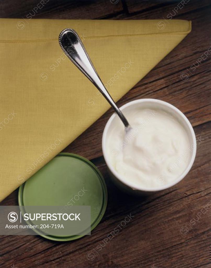 Stock Photo: 204-719A Close-up of yogurt in a container with a spoon