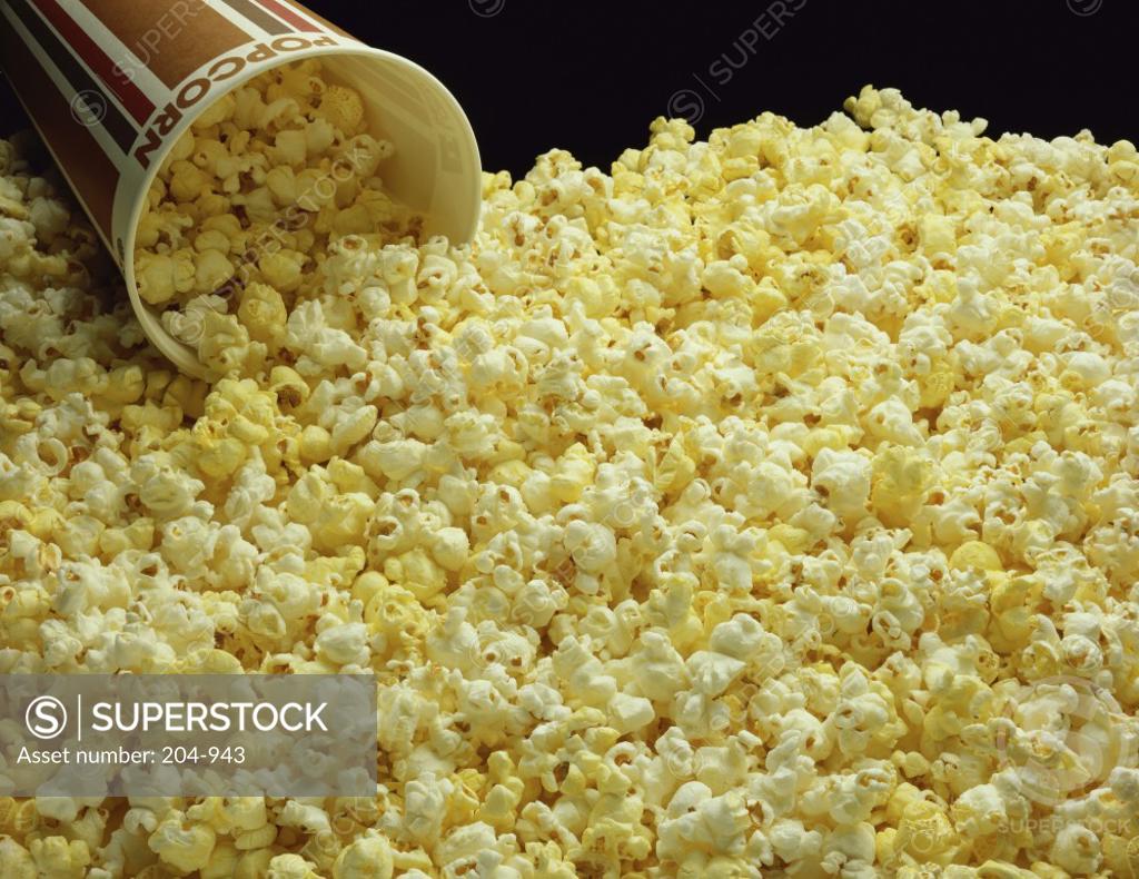 Stock Photo: 204-943 Close-up of popcorn with a disposable cup