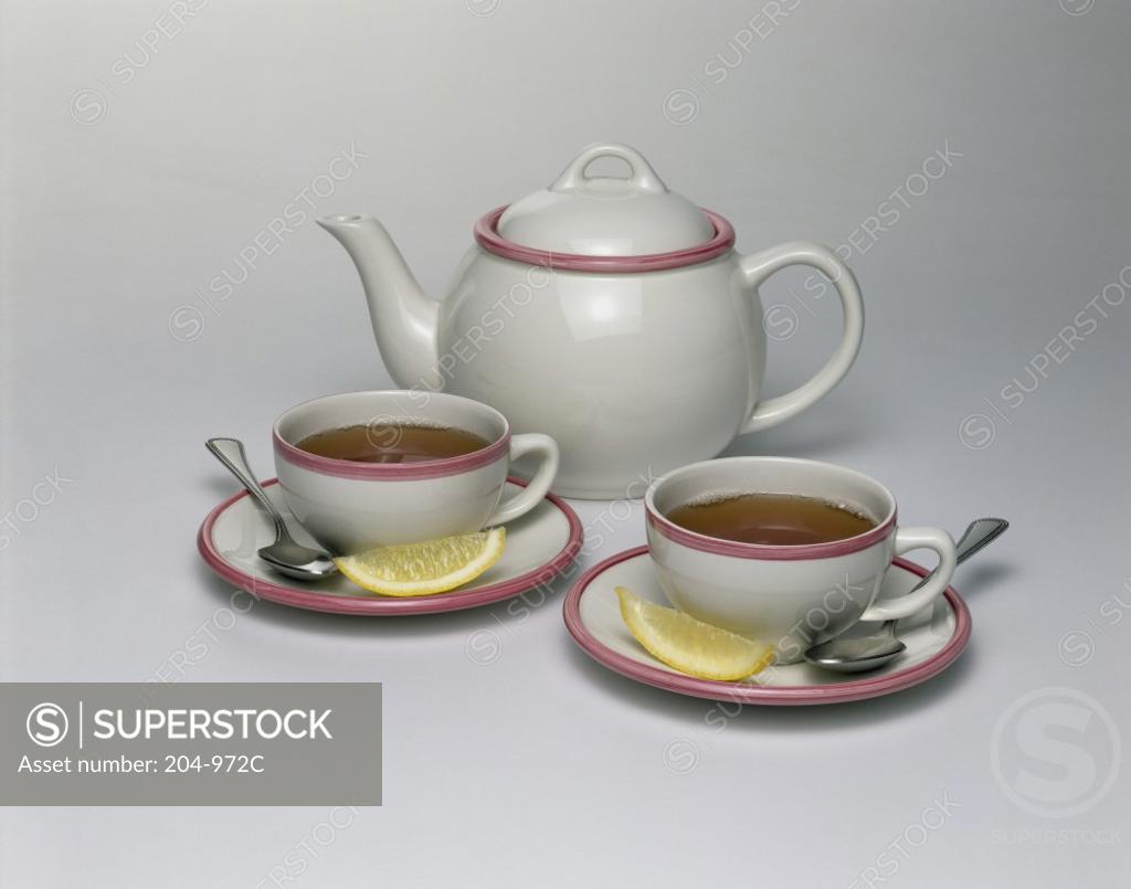 Stock Photo: 204-972C Close-up of a teapot with two cups of herbal tea