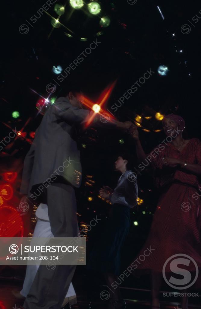 Stock Photo: 208-104 Two young couples dancing in a nightclub