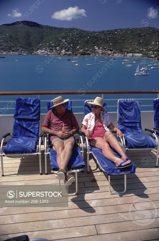 Stock Photo: 208-1393 High angle view of a senior couple sitting in lounge chairs