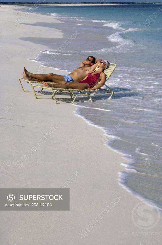 Stock Photo: 208-1910A Young couple sunbathing on the beach