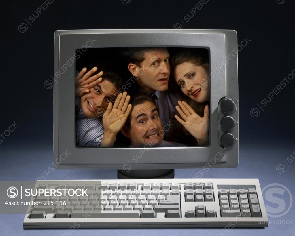 Stock Photo: 215-116 Portrait of three businessmen and a businesswoman in a computer monitor