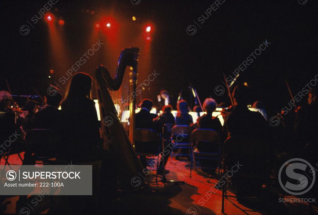 Stock Photo: 222-100A Group of musicians performing in a theater
