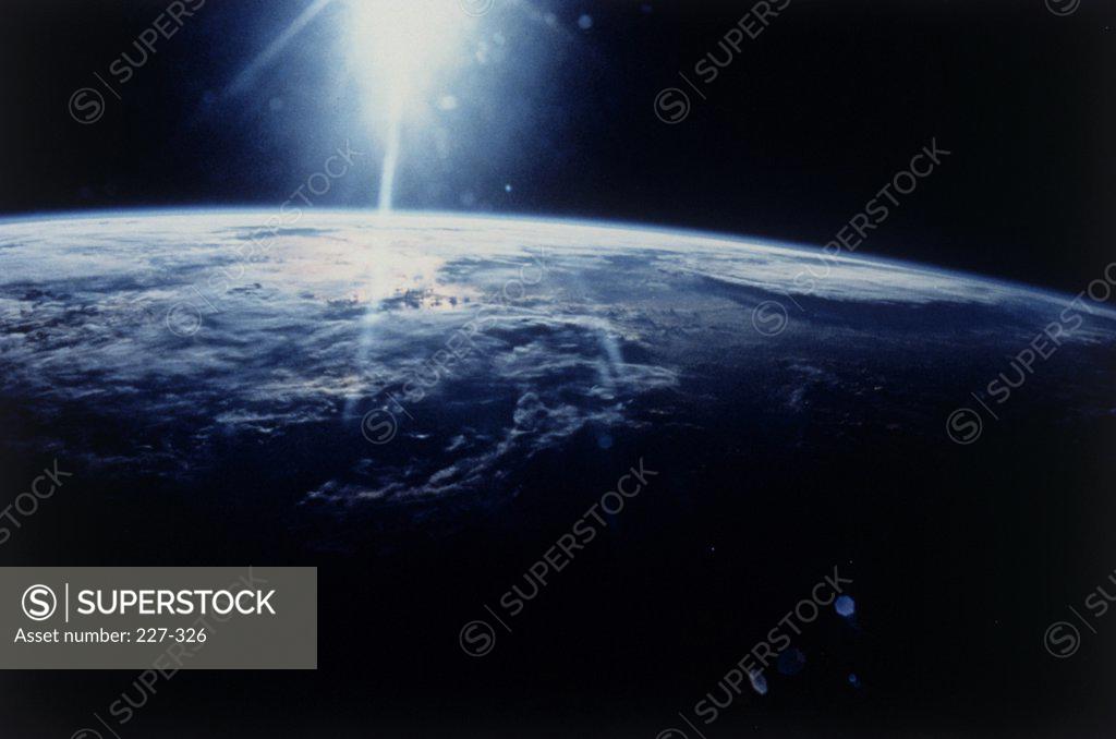 Stock Photo: 227-326 Satellite view of sunlight over the Earth, Discovery Space Shuttle