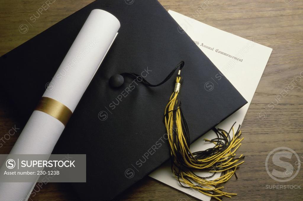 Stock Photo: 230-123B Close-up of a certificate with a mortar board and a diploma on a table
