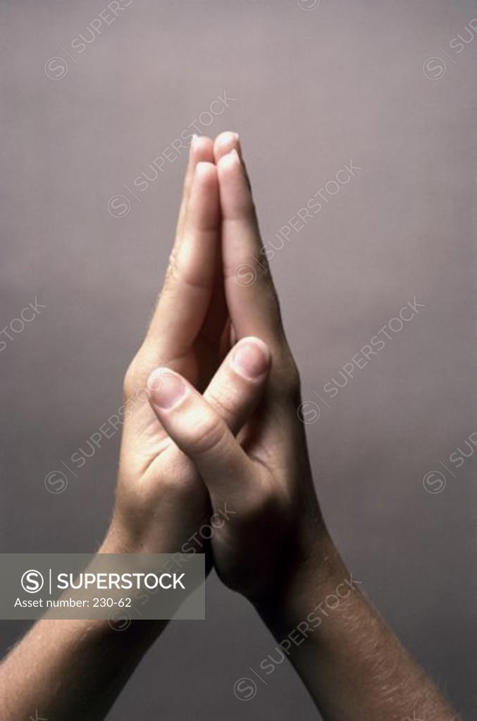 Stock Photo: 230-62 Close-up of a person's hands in the prayer position