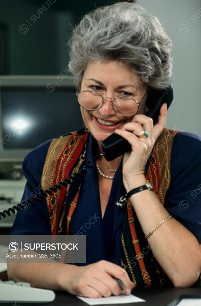 Stock Photo: 235-390E Close-up of a businesswoman talking on the telephone