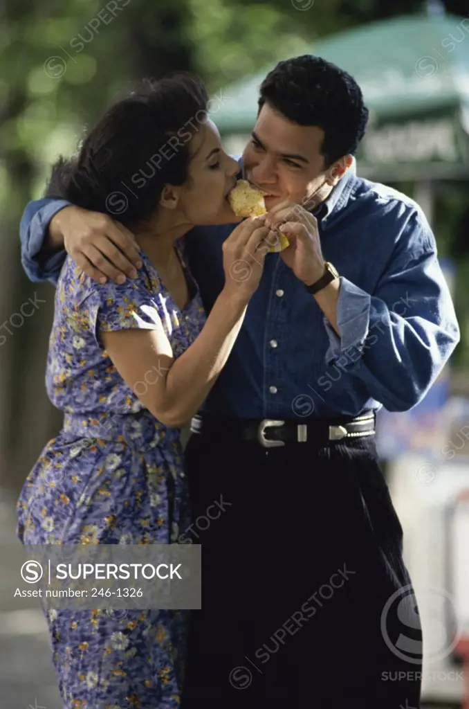 Young couple eating ice cream