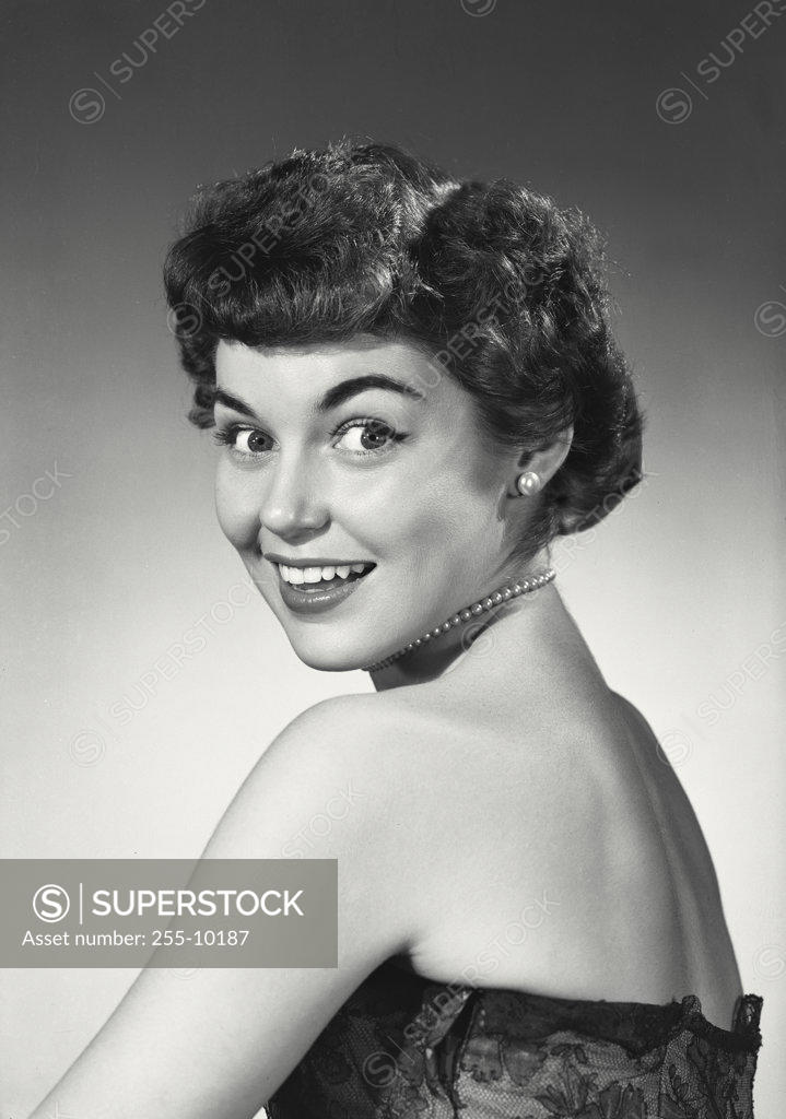 Stock Photo: 255-10187 Portrait of a young woman smiling