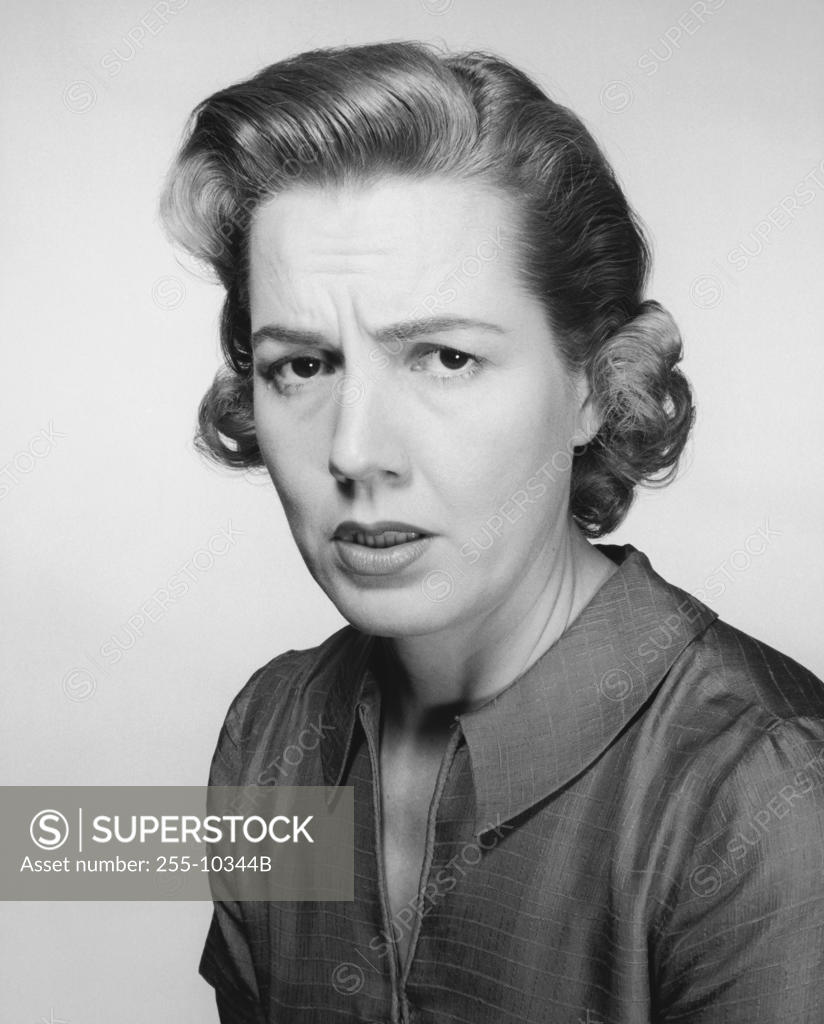 Stock Photo: 255-10344B Portrait of a young woman frowning