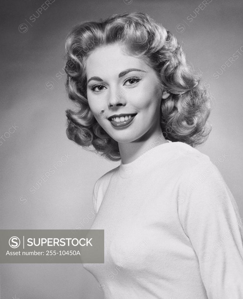 Stock Photo: 255-10450A Portrait of a young woman smiling