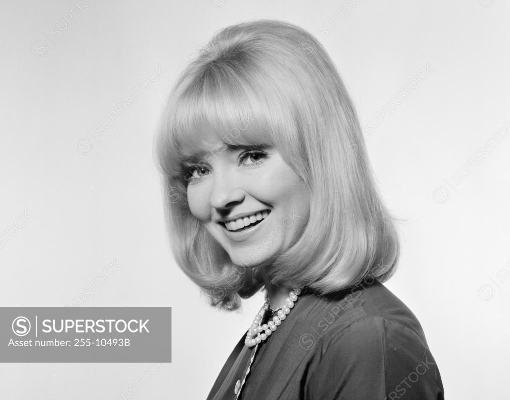 Stock Photo: 255-10493B Portrait of a young woman smiling