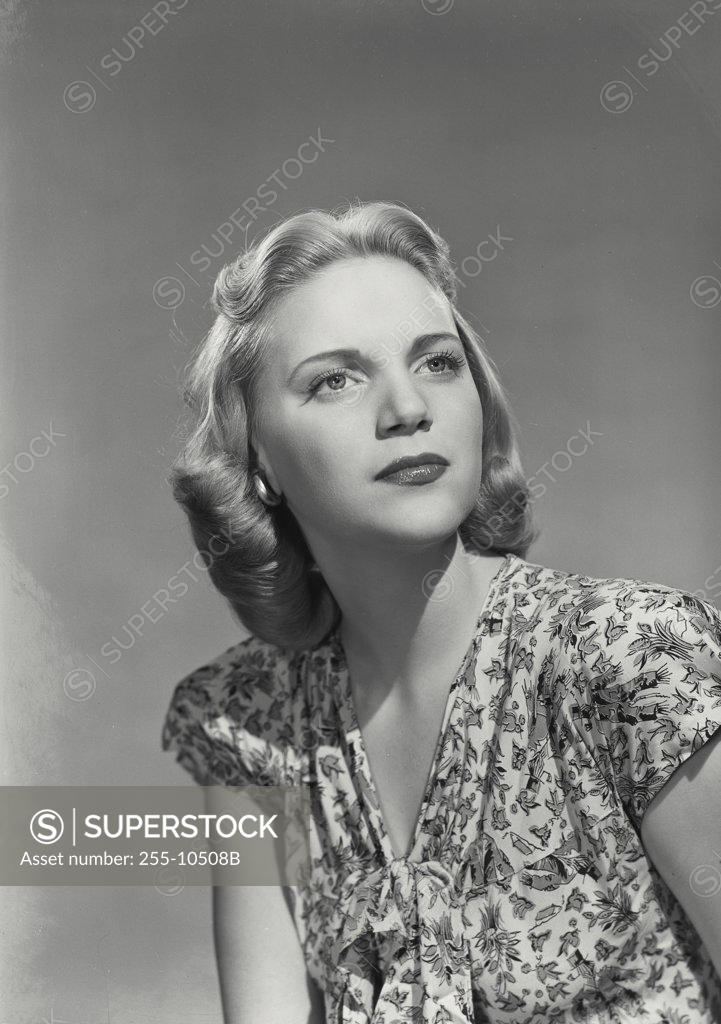 Stock Photo: 255-10508B Close-up of a young woman thinking