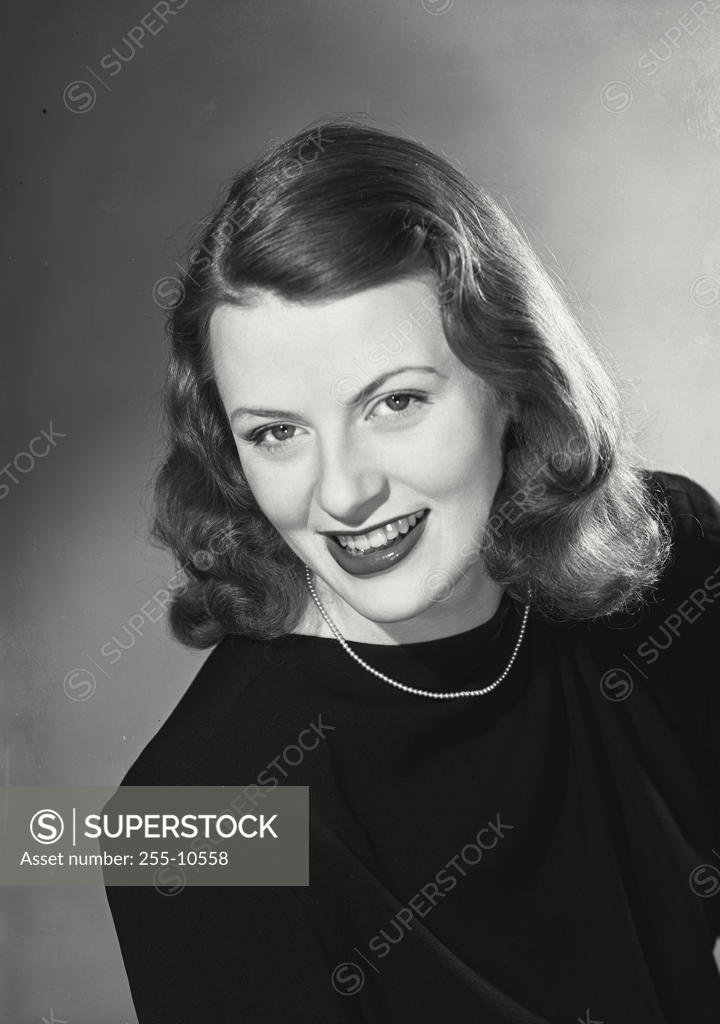 Stock Photo: 255-10558 Portrait of a young woman smiling